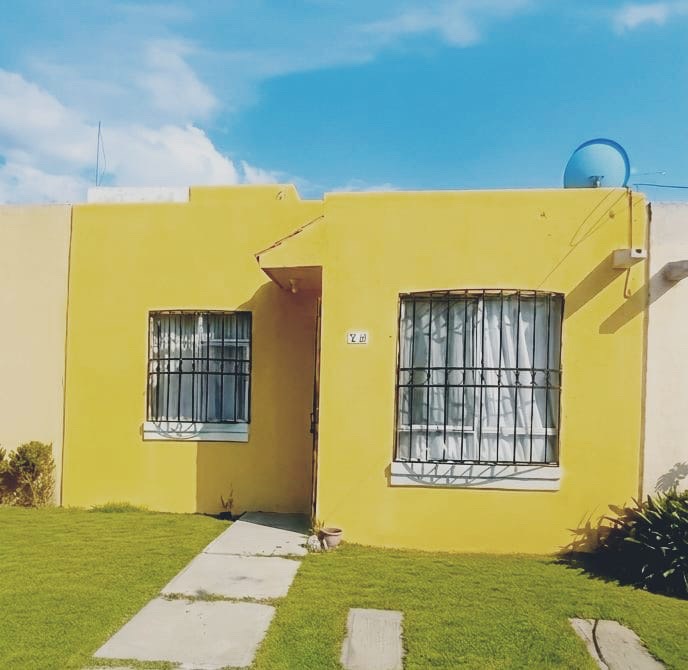 Fachada de inmueble color amarillo